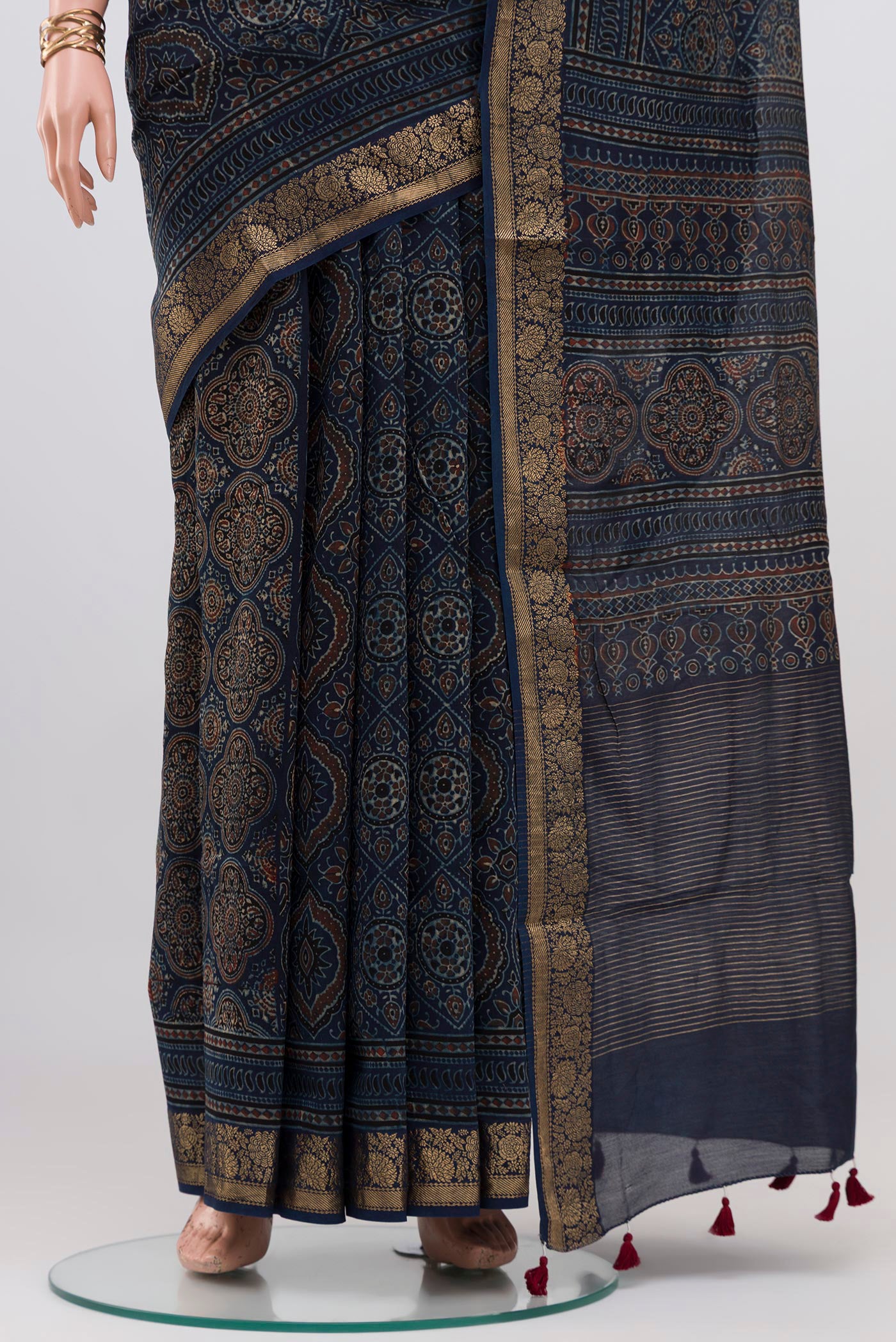 Pleats and pallu of Navy Blue Chanderi Silk Cotton Saree with Ajrakh Print on the body and Zari Border. 