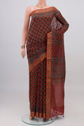 Rust Chanderi Silk Cotton Saree with Ajrakh Print on the body and Zari Border.  displayed on a mannequin