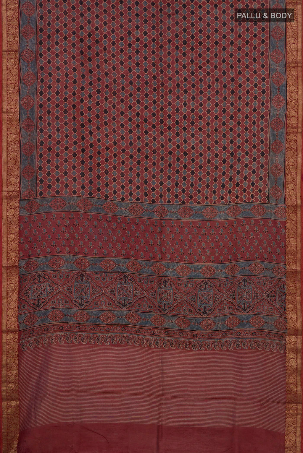 Flat view of Rust Chanderi Silk Cotton Saree with Ajrakh Print on the body and Zari Border. 