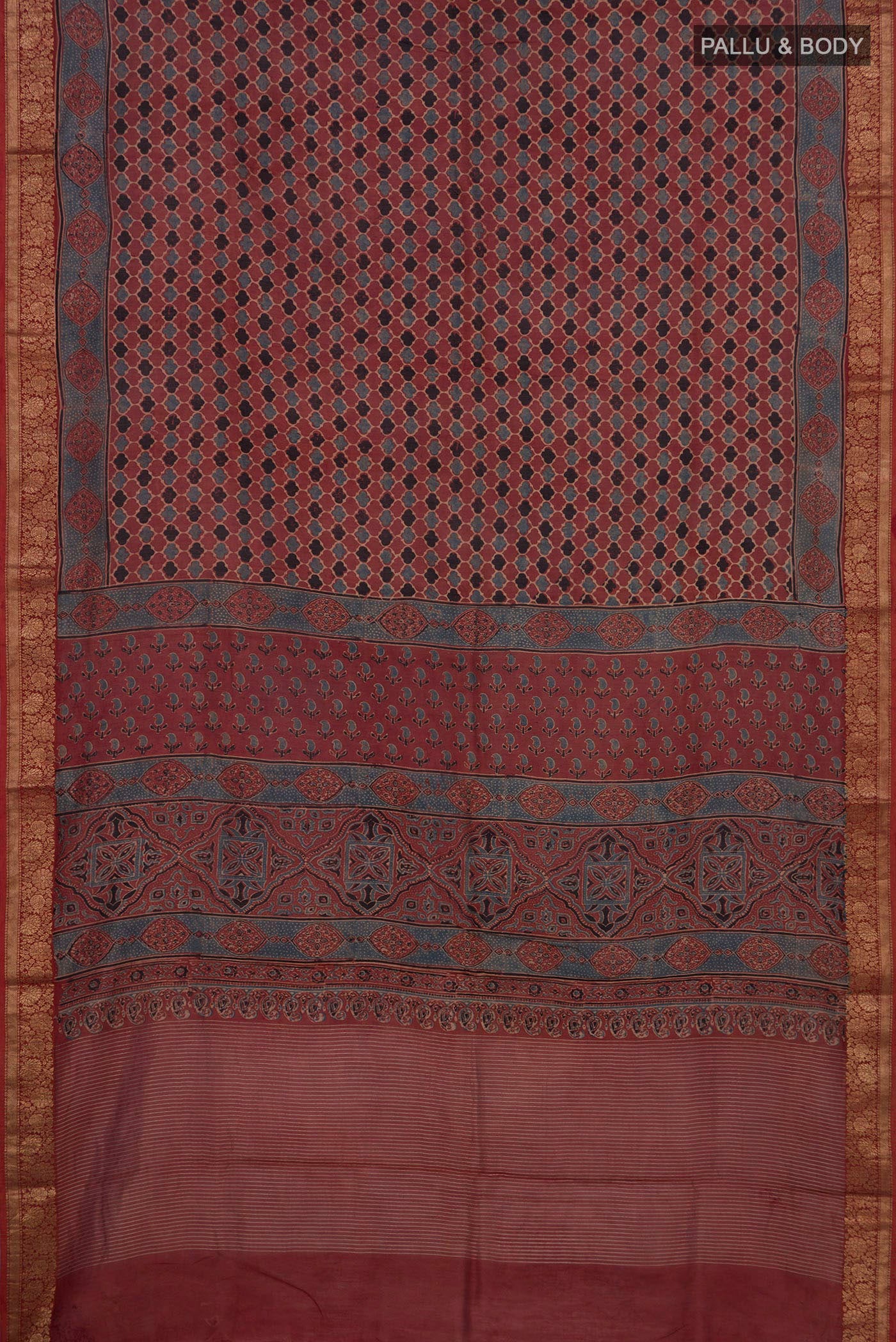 Flat view of Rust Chanderi Silk Cotton Saree with Ajrakh Print on the body and Zari Border. 