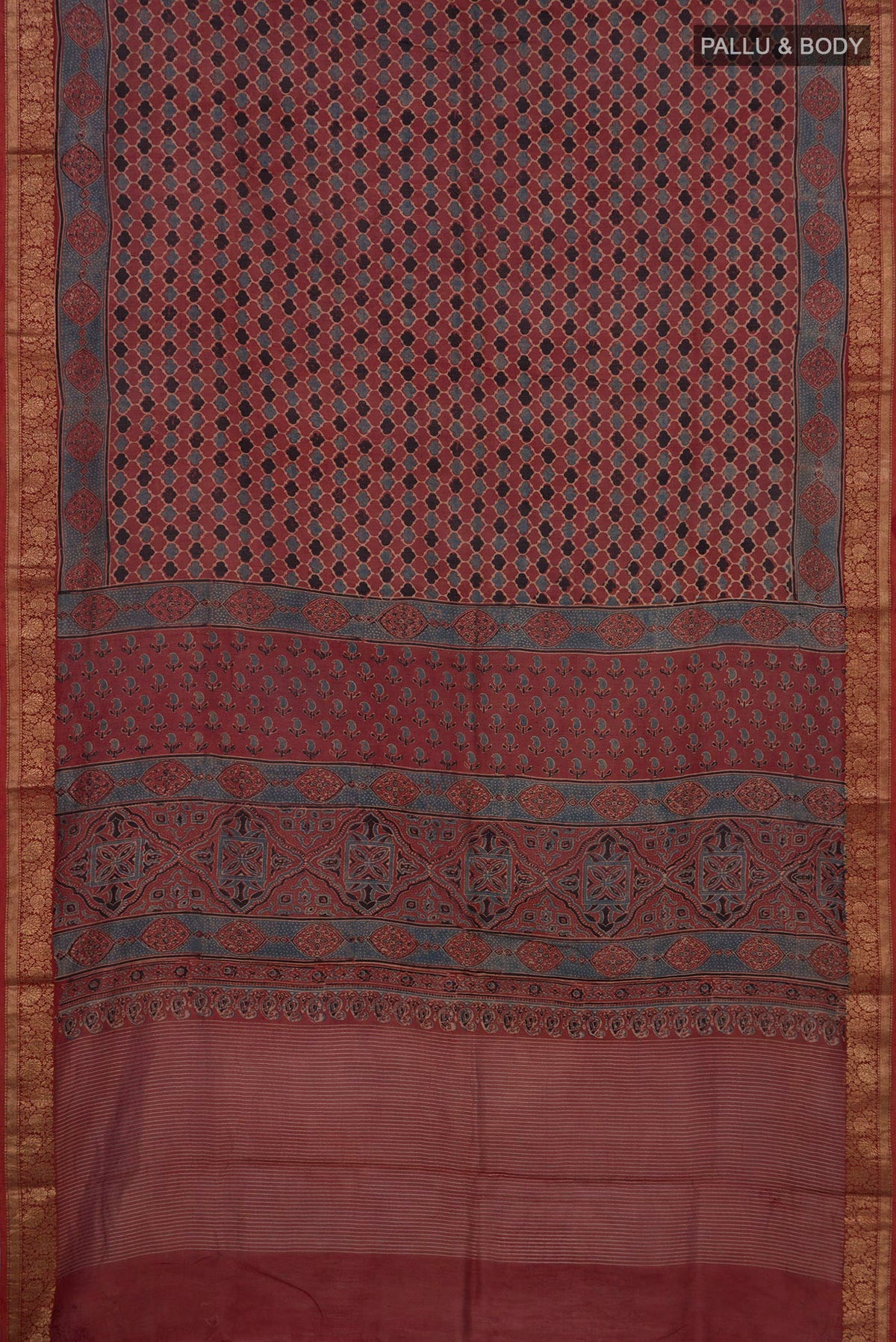 Flat view of Rust Chanderi Silk Cotton Saree with Ajrakh Print on the body and Zari Border. 