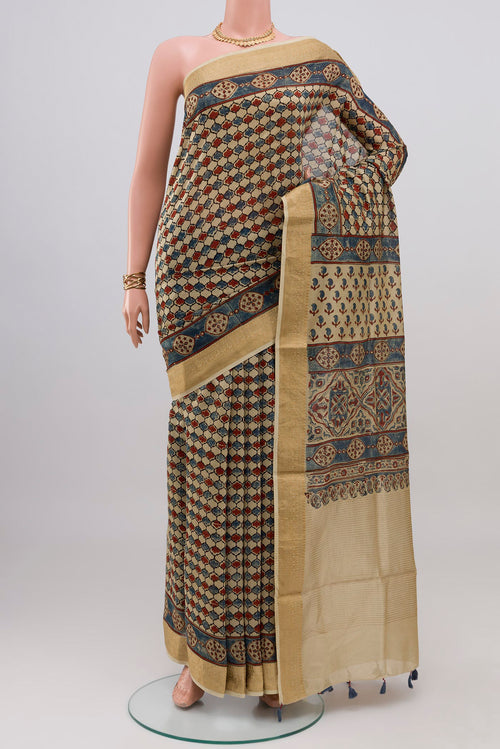 Beige Chanderi Silk Cotton Saree with Ajrakh Print on the body and Zari Border.  displayed on a mannequin