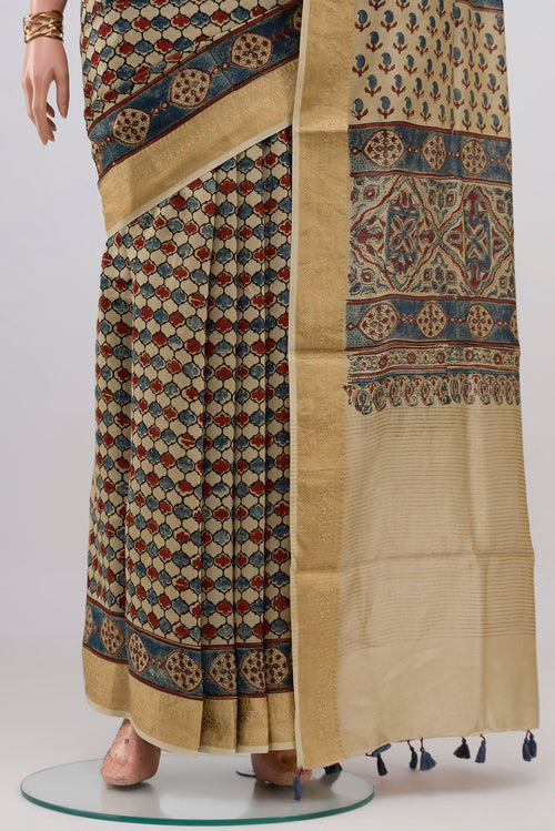 Pleats and pallu of Beige Chanderi Silk Cotton Saree with Ajrakh Print on the body and Zari Border. 