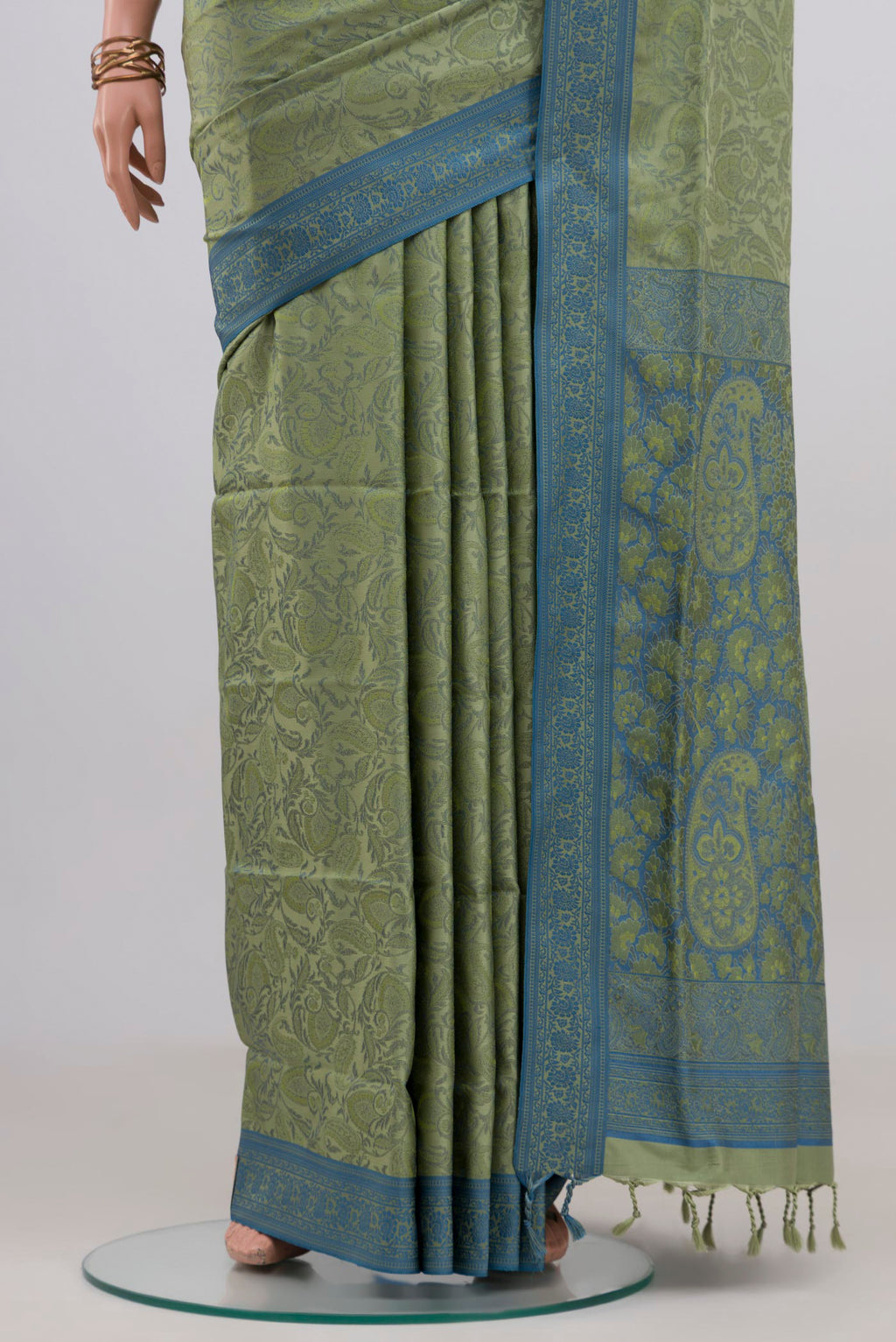 Pleats and pallu of Light Green Soft Silk Saree with Jacquard design on the body and Thread Border. 