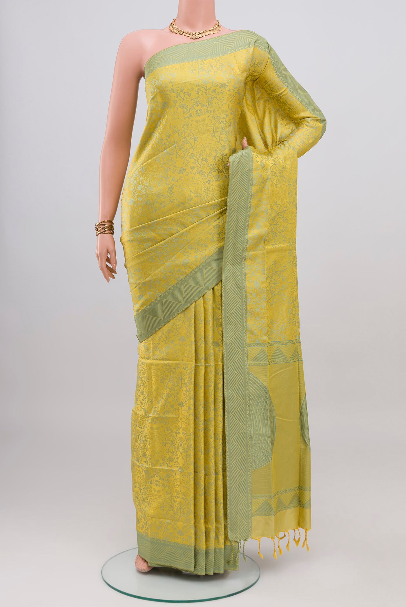Lemon Yellow Soft Silk Saree with Jacquard design on the body and Thread Border.  displayed on a mannequin
