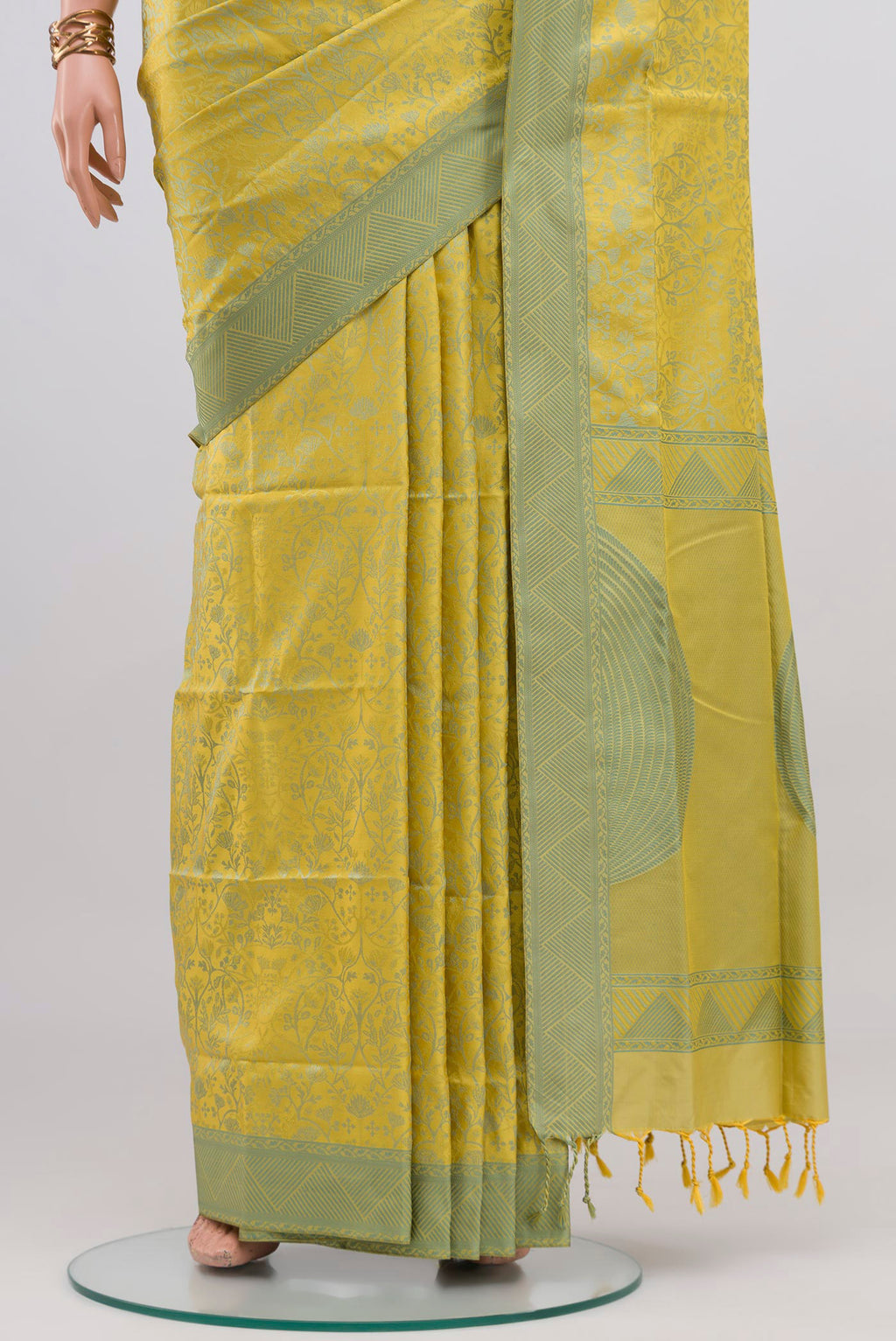 Pleats and pallu of Lemon Yellow Soft Silk Saree with Jacquard design on the body and Thread Border. 