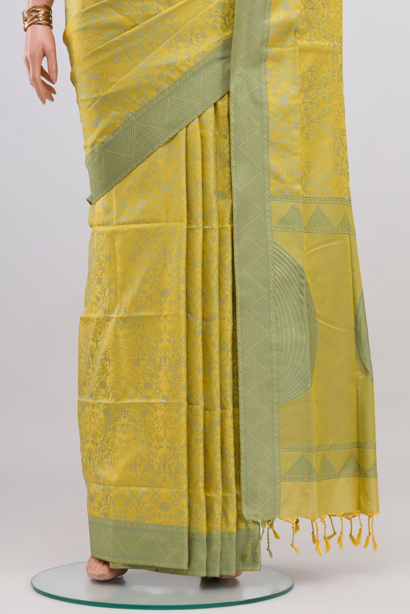 Pleats and pallu of Lemon Yellow Soft Silk Saree with Jacquard design on the body and Thread Border. 