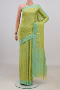 Pure Silk Green Soft Saree with Jacquard design on the body and Thread Border.  displayed on a mannequin