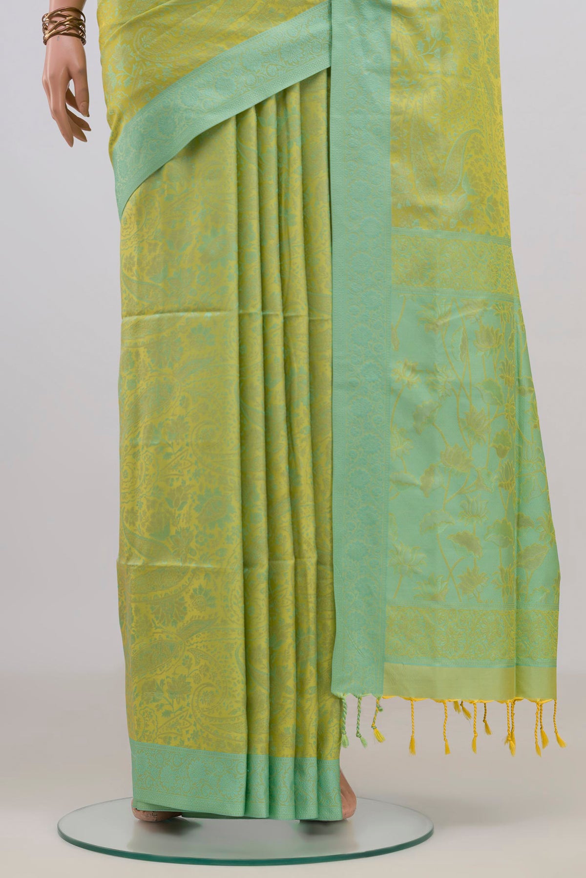 Pleats and pallu of Pure Silk Green Soft Saree with Jacquard design on the body and Thread Border. 
