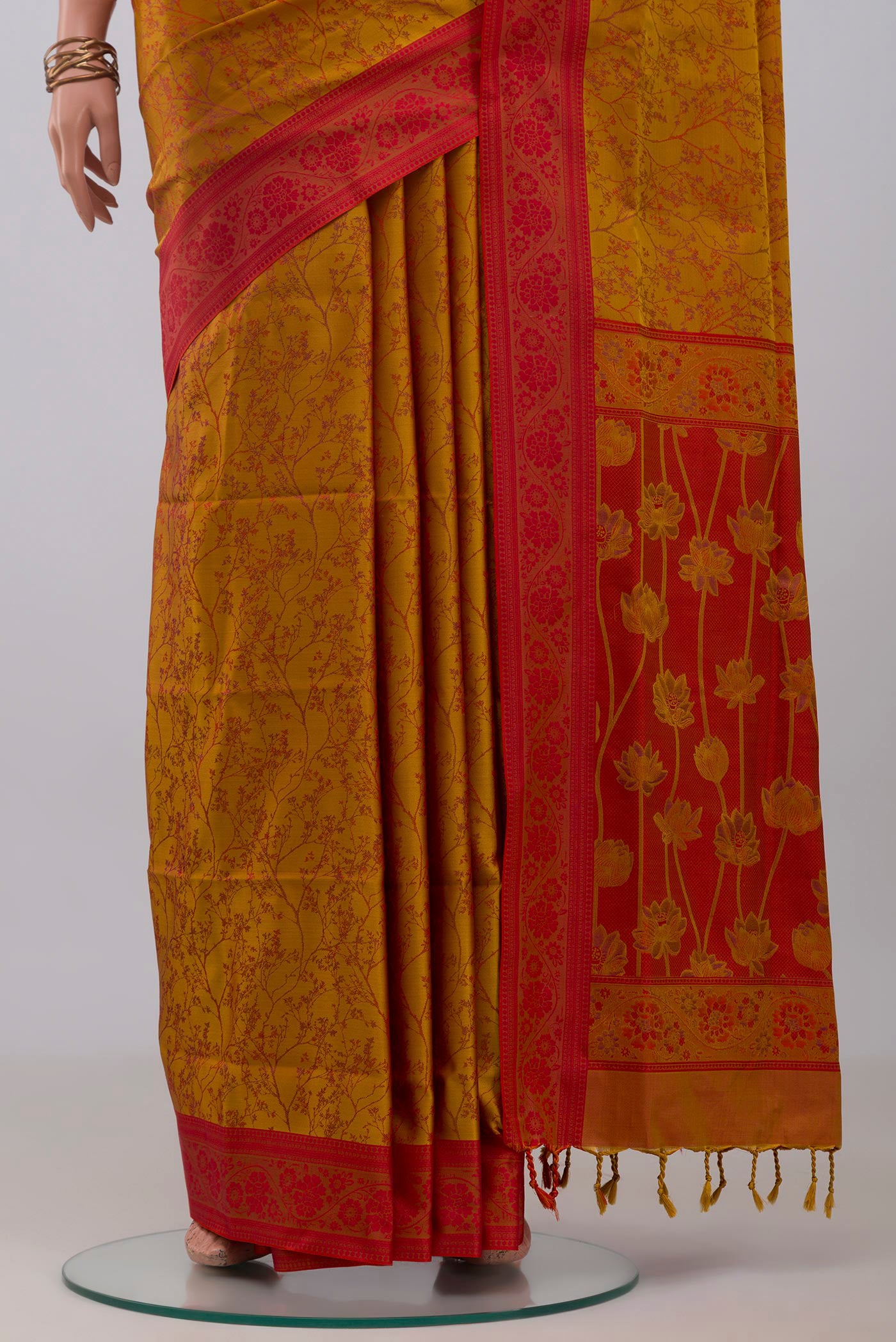 Pleats and pallu of Mustard Soft Silk Saree with Jacquard design on the body and Thread Border. 