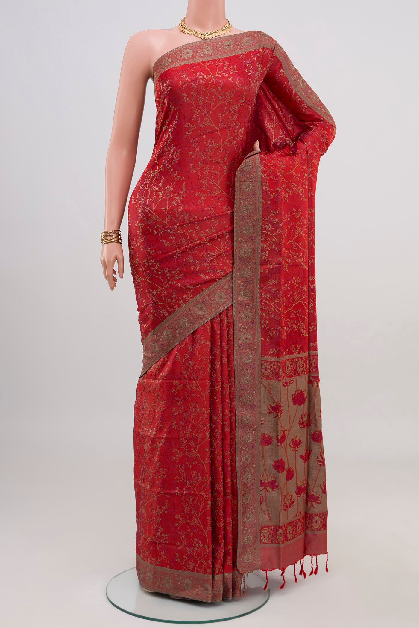 Red Soft Silk Saree with Jacquard design on the body and Thread Border.  displayed on a mannequin