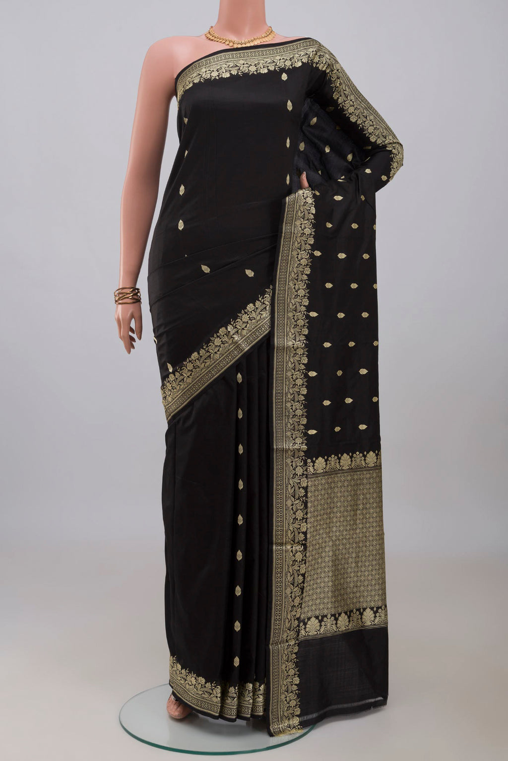 Black Banarasi Katan Silk Saree with Thread Butta on the body and Thread Border.  displayed on a mannequin