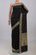 Black Banarasi Katan Silk Saree with Thread Butta on the body and Thread Border.  displayed on a mannequin
