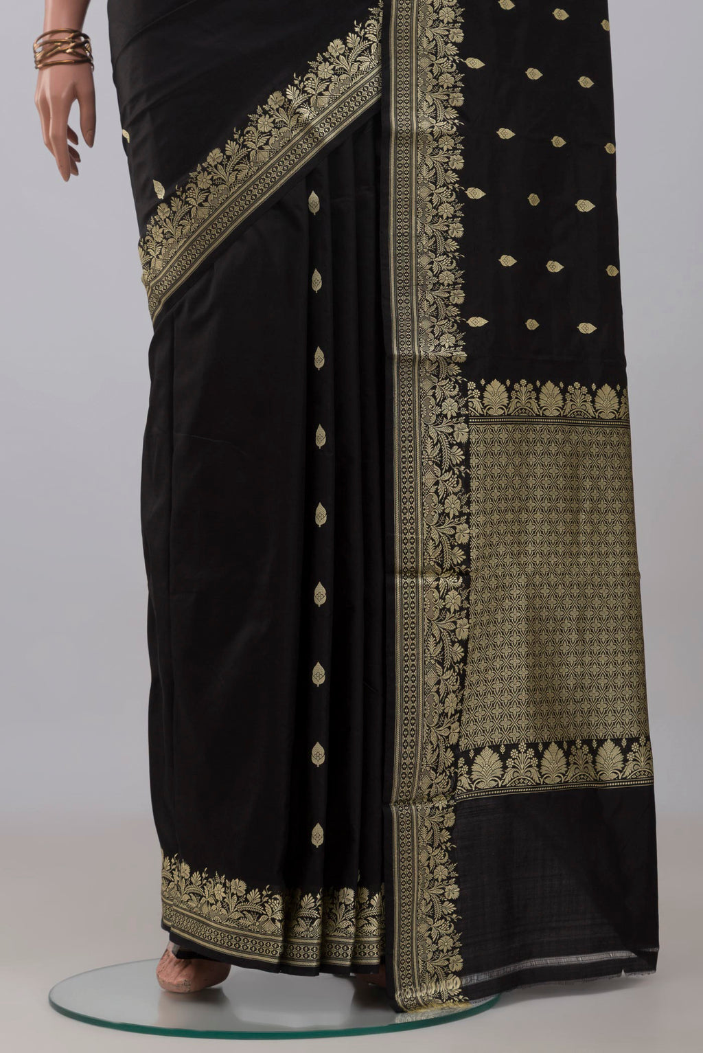 Pleats and pallu of Black Banarasi Katan Silk Saree with Thread Butta on the body and Thread Border. 