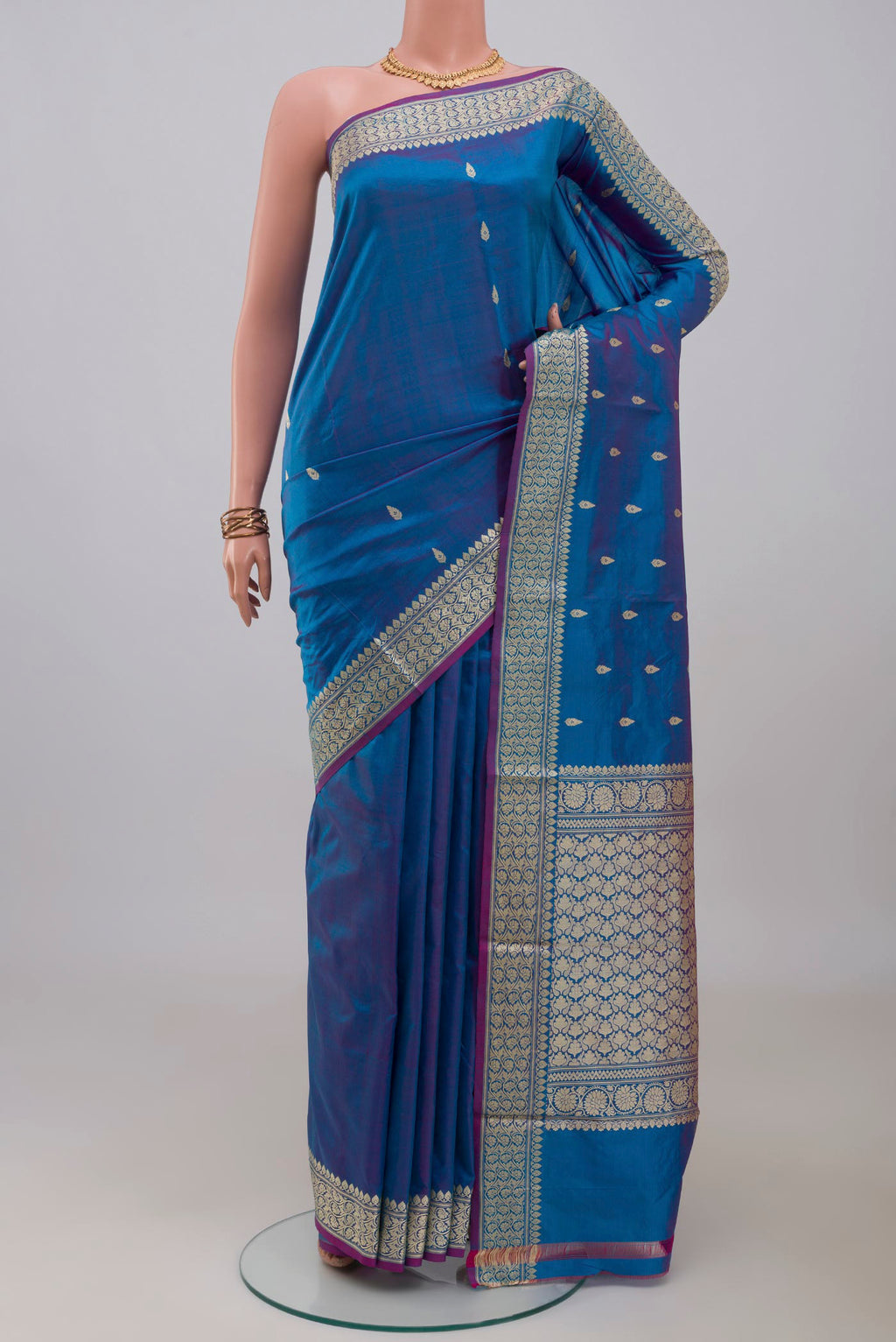Blue Banarasi Katan Silk Saree with Thread Butta on the body and Thread Border.  displayed on a mannequin