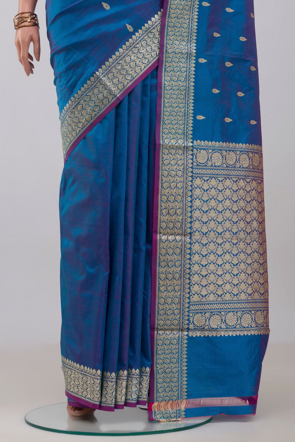 Pleats and pallu of Blue Banarasi Katan Silk Saree with Thread Butta on the body and Thread Border. 