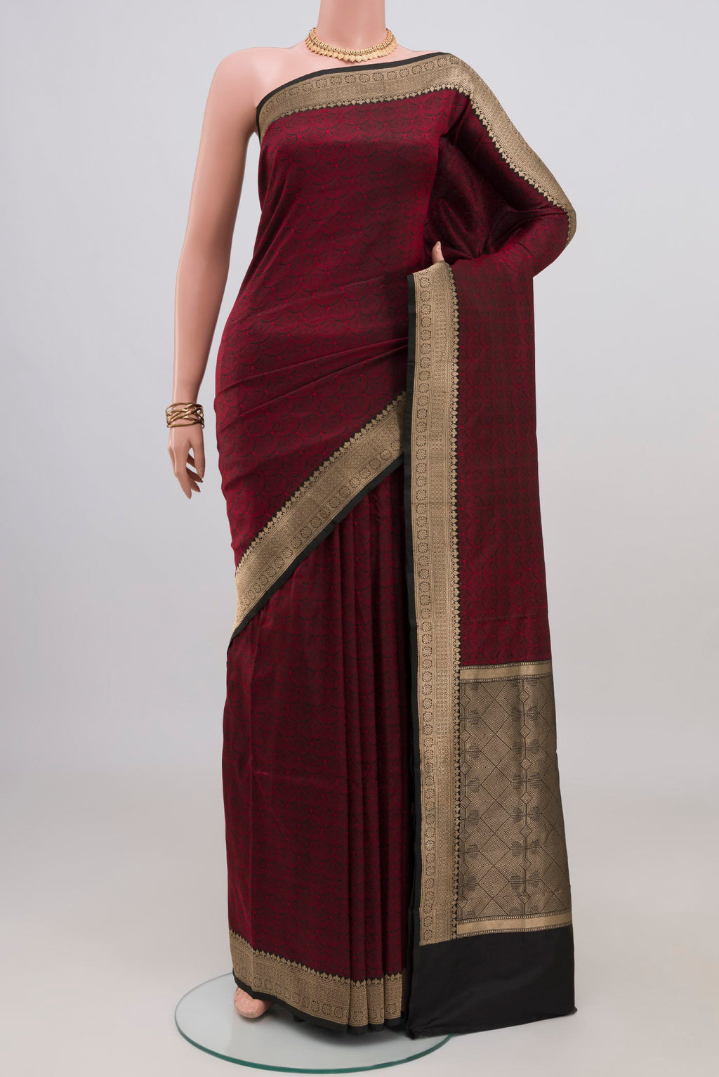 Black Banarasi Katan Silk Saree with Jacquard design on the body and Zari Border.  displayed on a mannequin