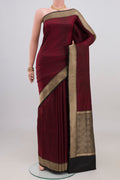 Black Banarasi Katan Silk Saree with Jacquard design on the body and Zari Border.  displayed on a mannequin