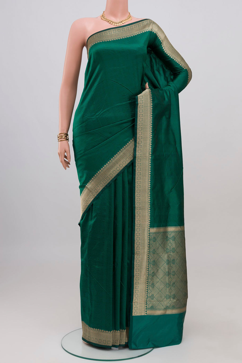 Green Banarasi Katan Silk Saree with Plain Body and Zari Border.  displayed on a mannequin