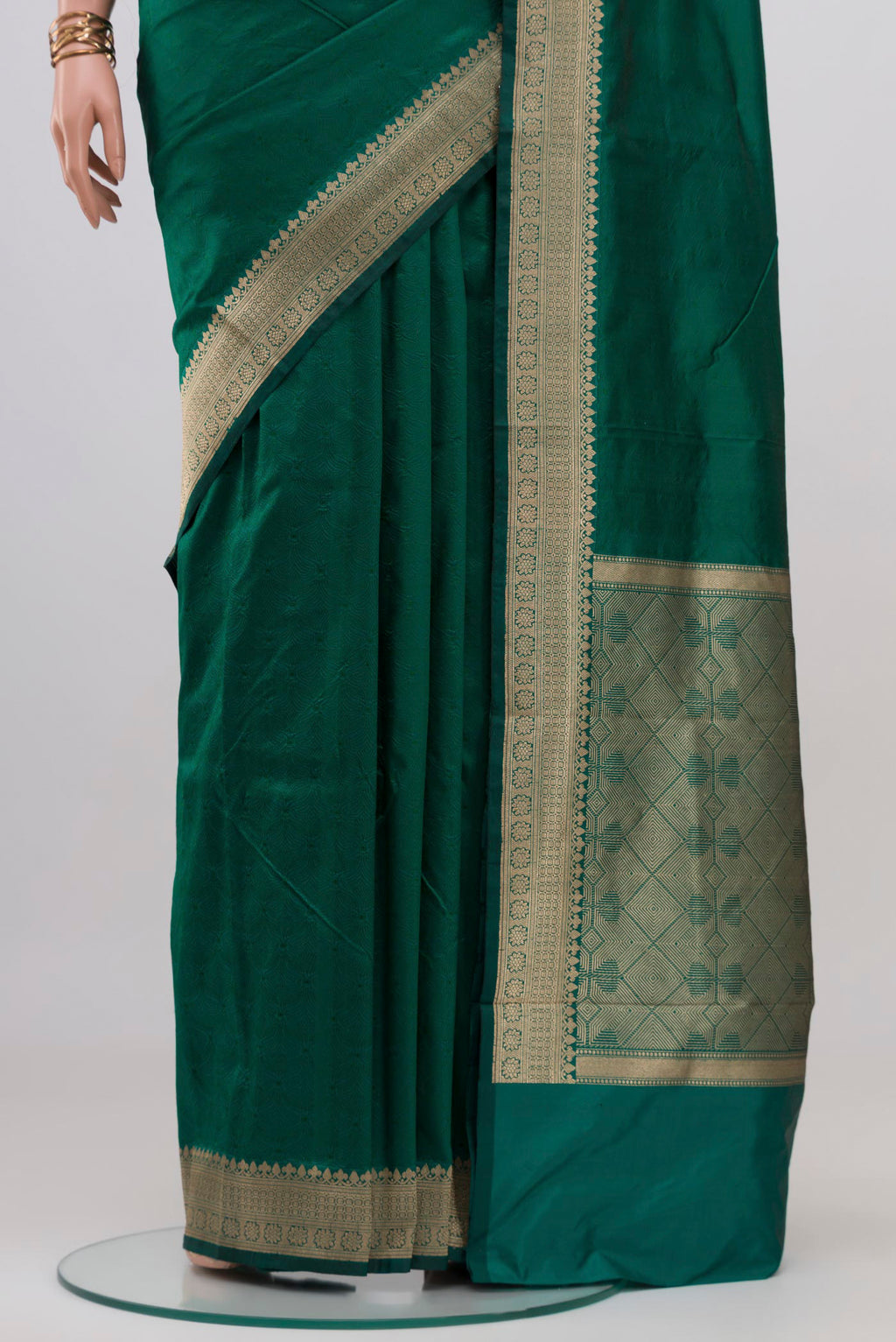 Pleats and pallu of Green Banarasi Katan Silk Saree with Plain Body and Zari Border. 