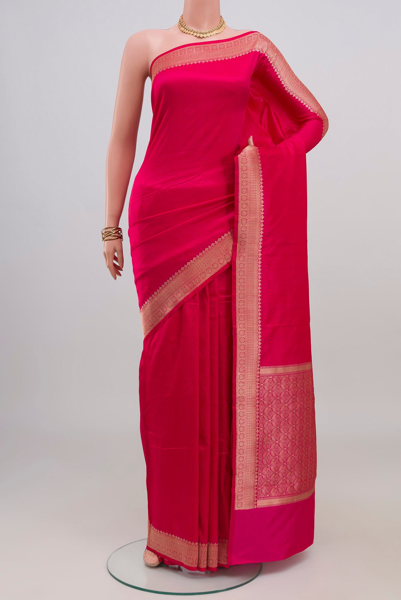 Pink Banarasi Katan Silk Saree with Jacquard design on the body and Zari Border.  displayed on a mannequin