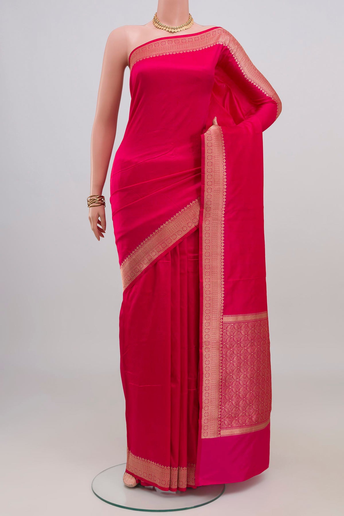 Pink Banarasi Katan Silk Saree with Jacquard design on the body and Zari Border.  displayed on a mannequin