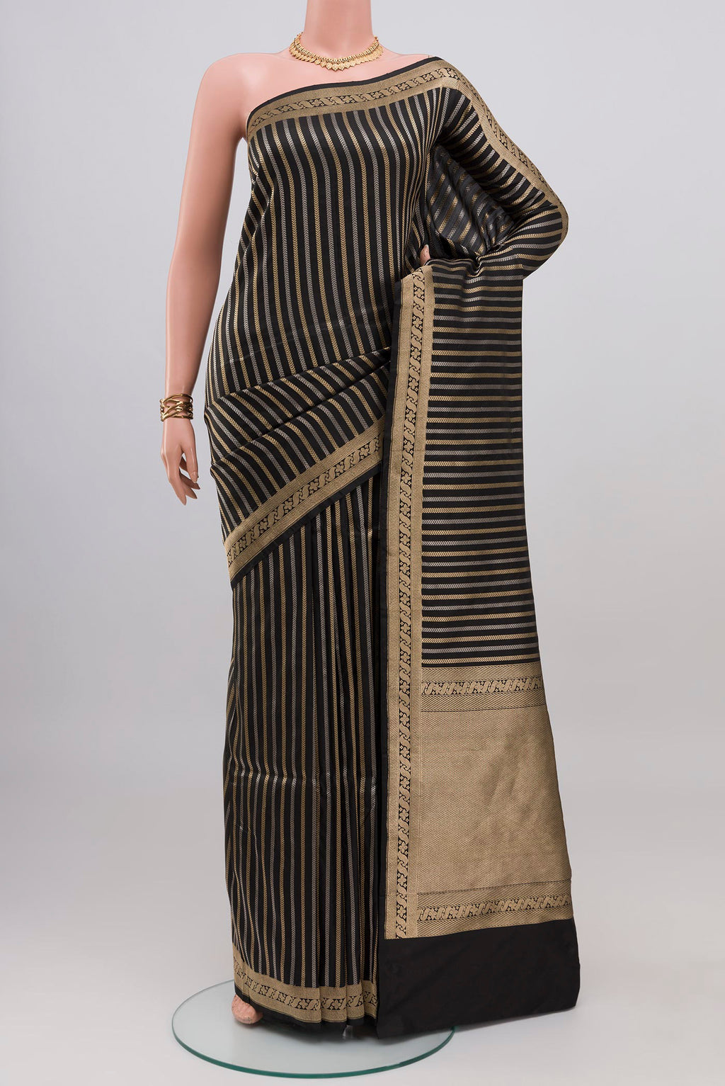 Black Banarasi Katan Silk Saree with Stripes on the body and Zari Border.  displayed on a mannequin