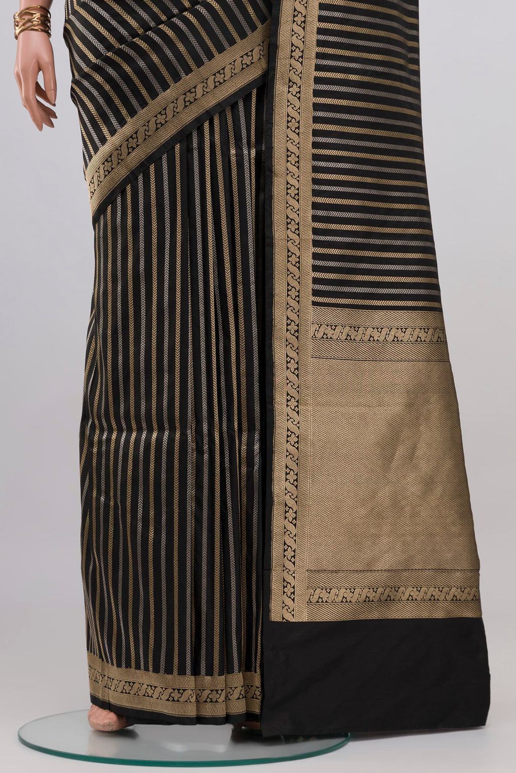 Pleats and pallu of Black Banarasi Katan Silk Saree with Stripes on the body and Zari Border. 