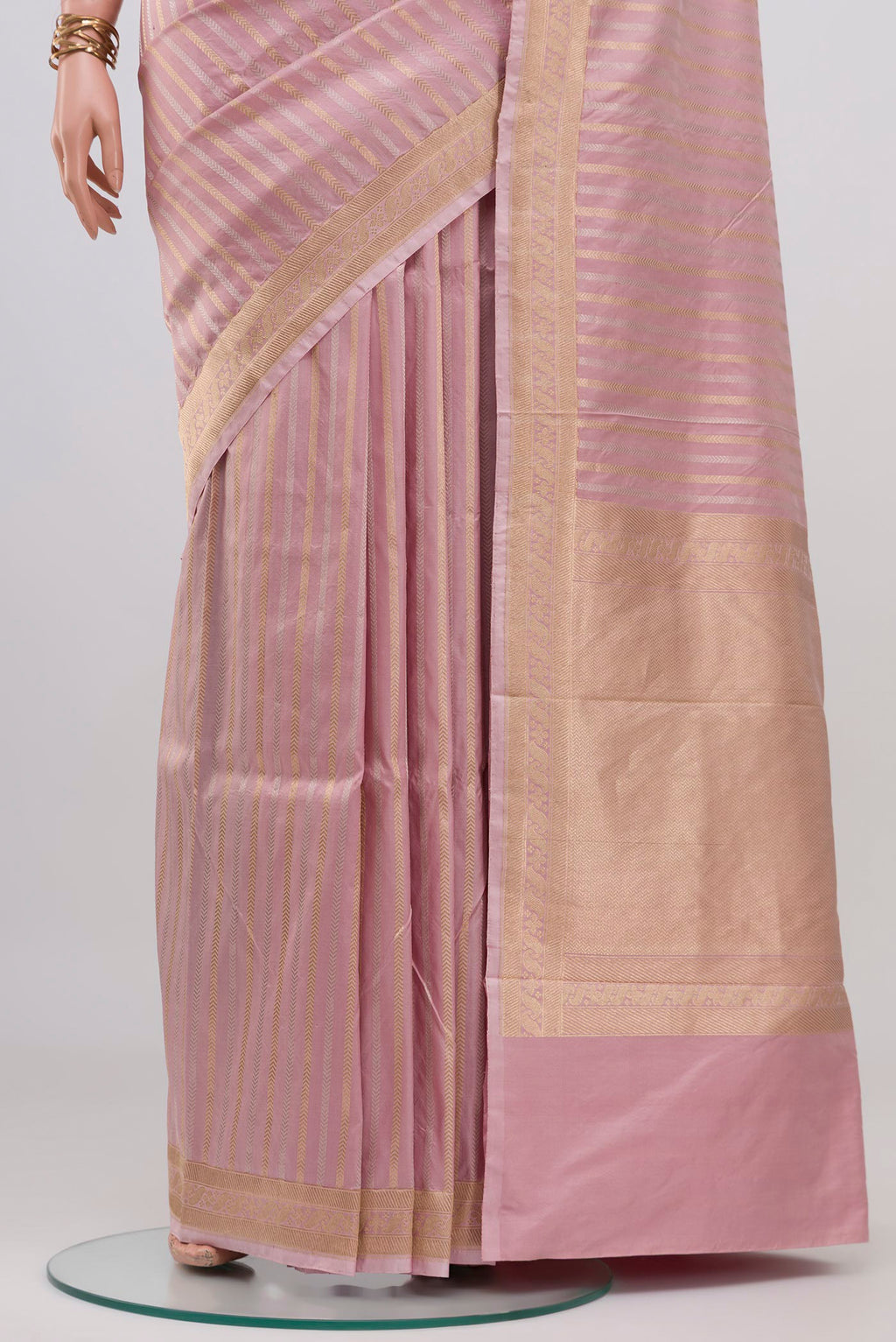 Pleats and pallu of Rose pink Banarasi Katan Silk Saree with Stripes on the body and Zari Border. 