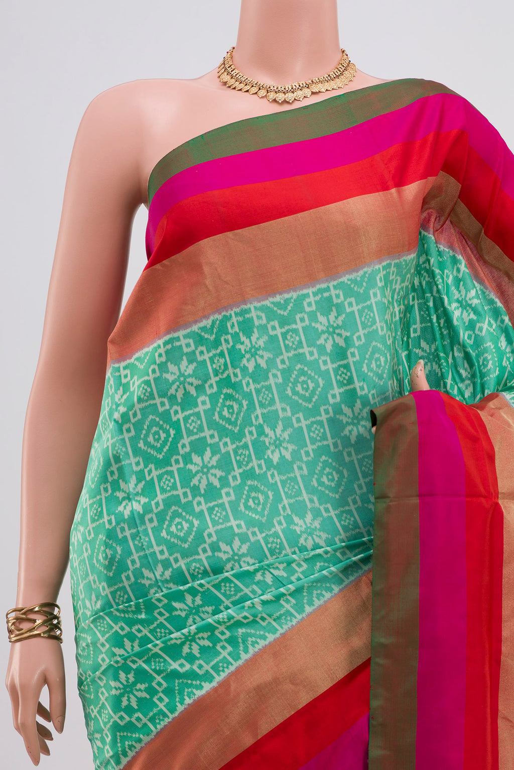 Border image of Green Pochampally Saree with Ikat design on the body and Zari Border. 