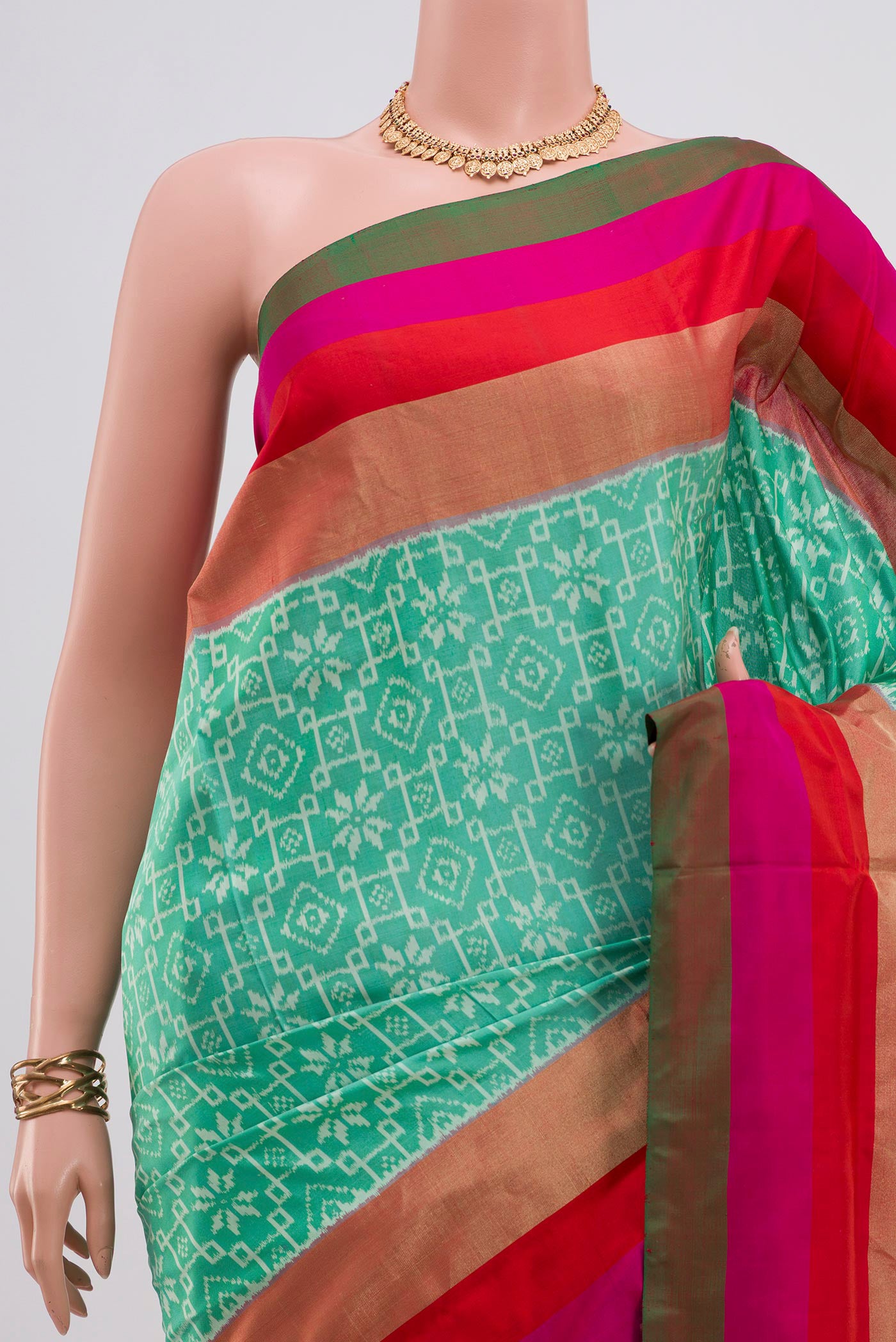 Border image of Green Pochampally Saree with Ikat design on the body and Zari Border. 