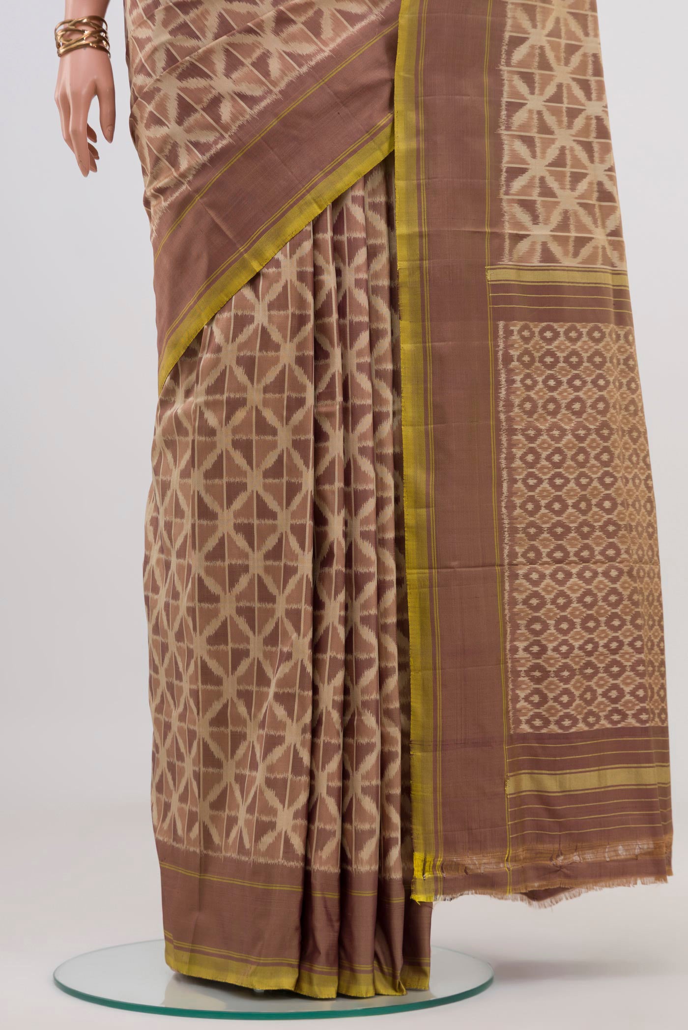 Pleats and pallu of Beige Pochampally Saree with Ikat design on the body and Plain Border. 