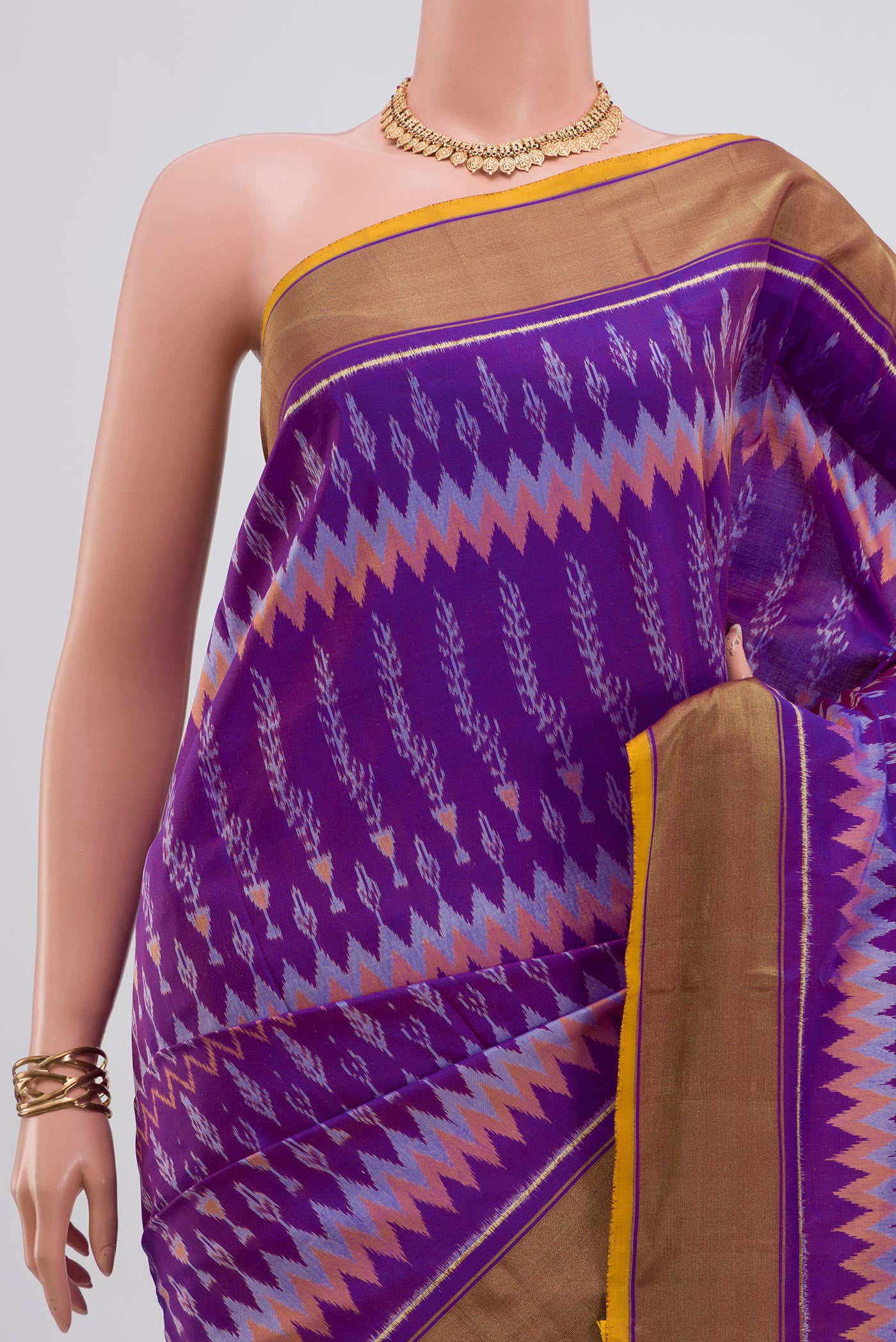 Border image of Lavender Pochampally Saree with Ikat design on the body and Zari Border. 