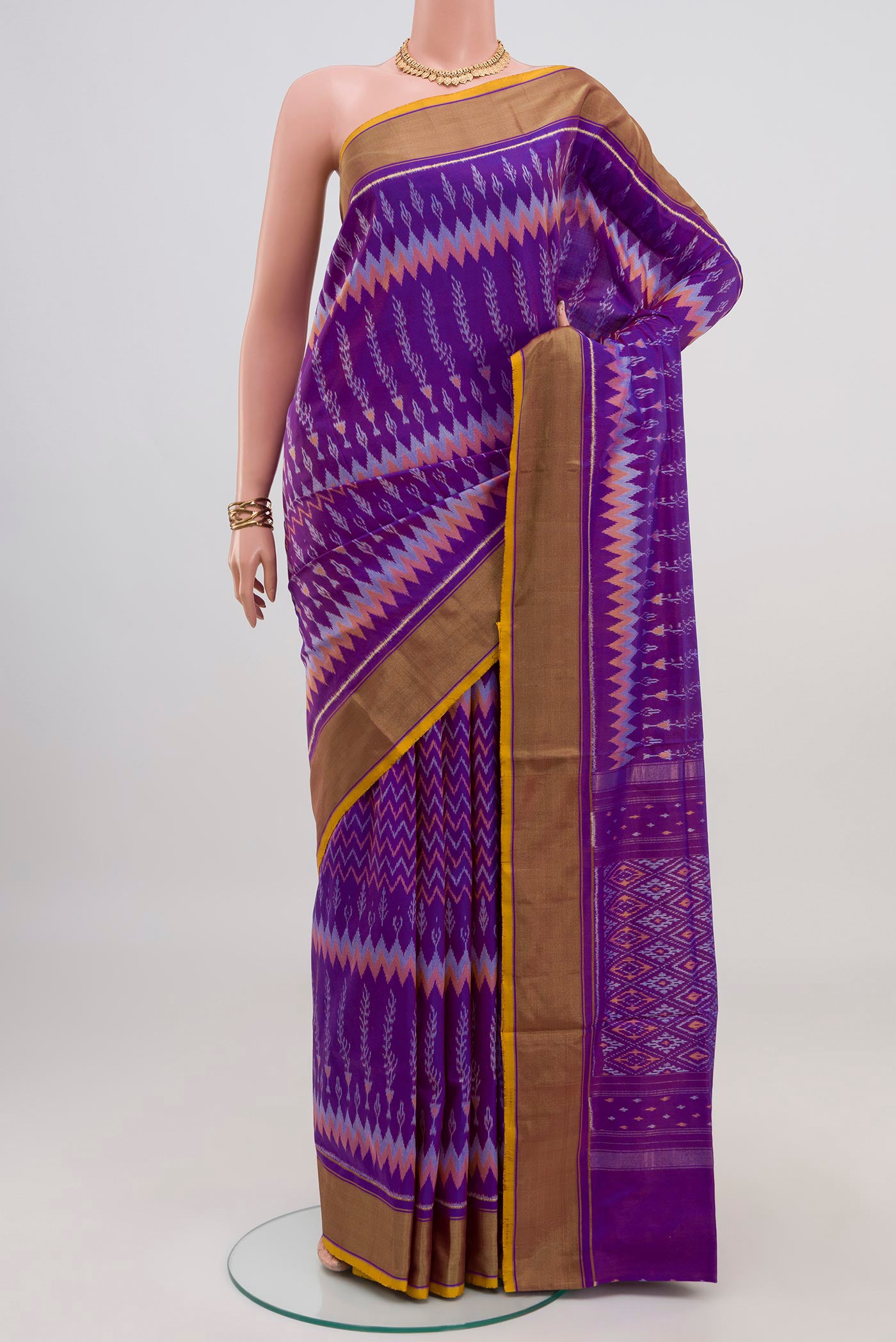 Lavender Pochampally Saree with Ikat design on the body and Zari Border.  displayed on a mannequin