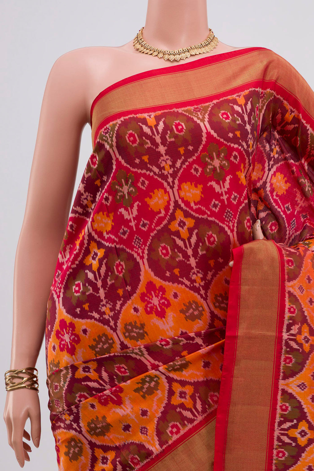 Border image of Red Pochampally Saree with Ikat design on the body and Zari Border. 