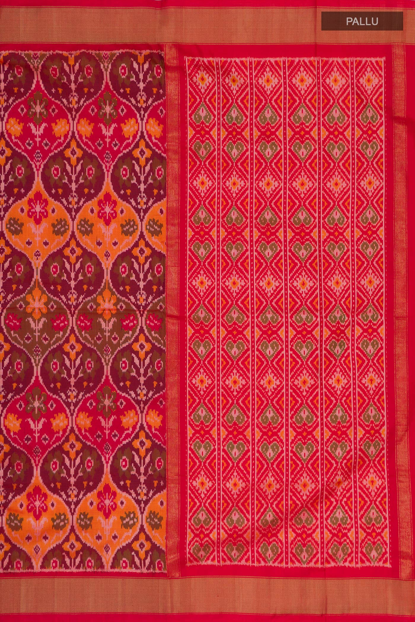 Close up image of the pallu of Red Pochampally Saree with Ikat design on the body and Zari Border. 