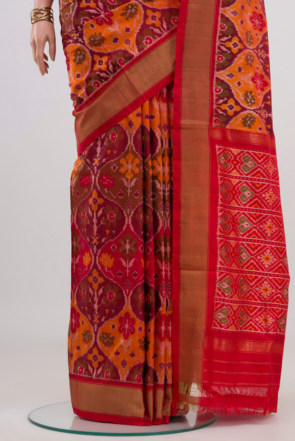 Pleats and pallu of Red Pochampally Saree with Ikat design on the body and Zari Border. 
