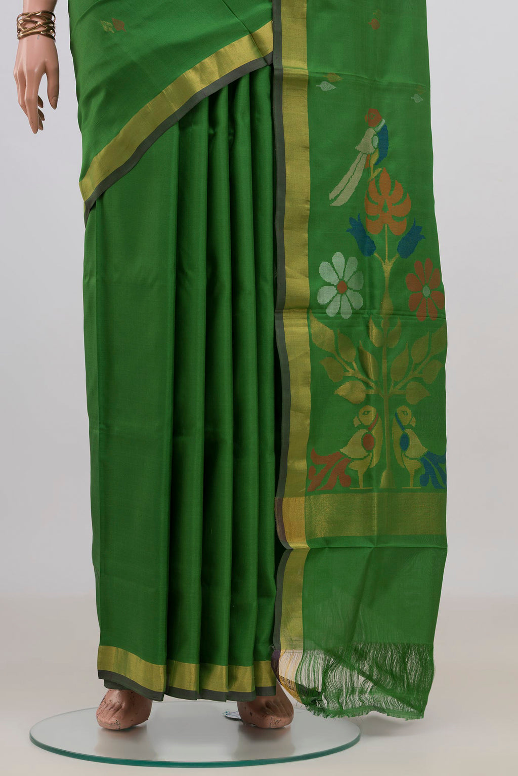 Pleats and pallu of Pure Silk Green Uppada Saree with Thread Butta on the body and Zari Border. 