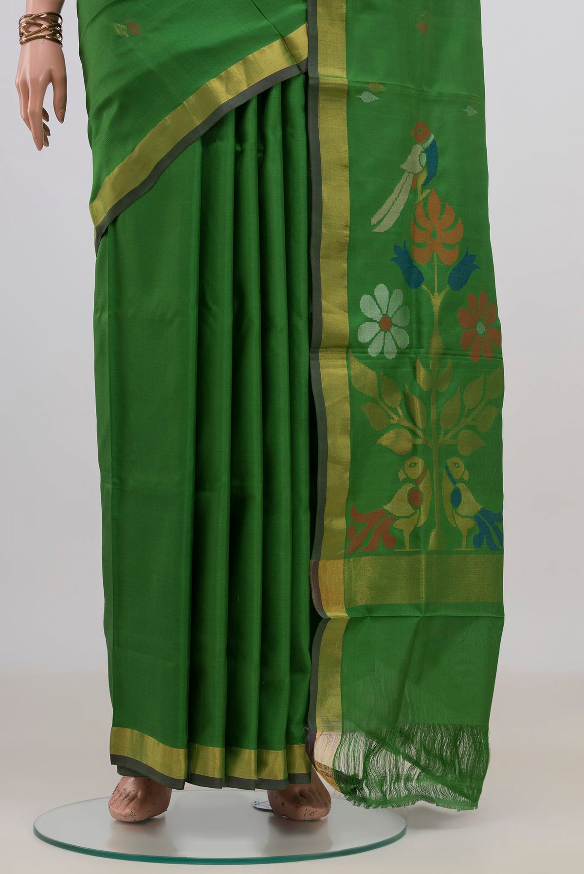 Pleats and pallu of Pure Silk Green Uppada Saree with Thread Butta on the body and Zari Border. 