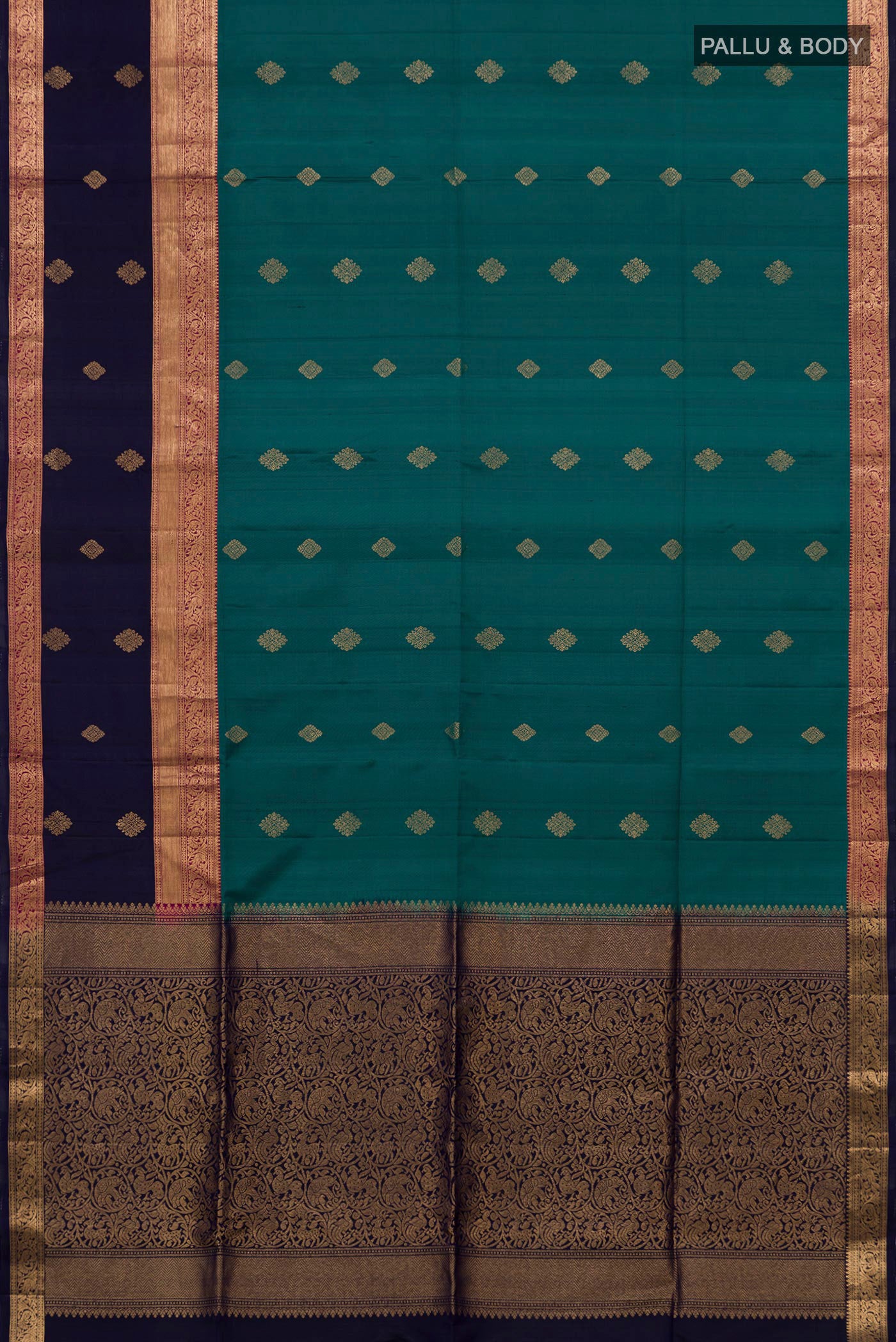 Flat view of Teal Soft Silk Saree with Zari Butta on the body and Fancy Border. 