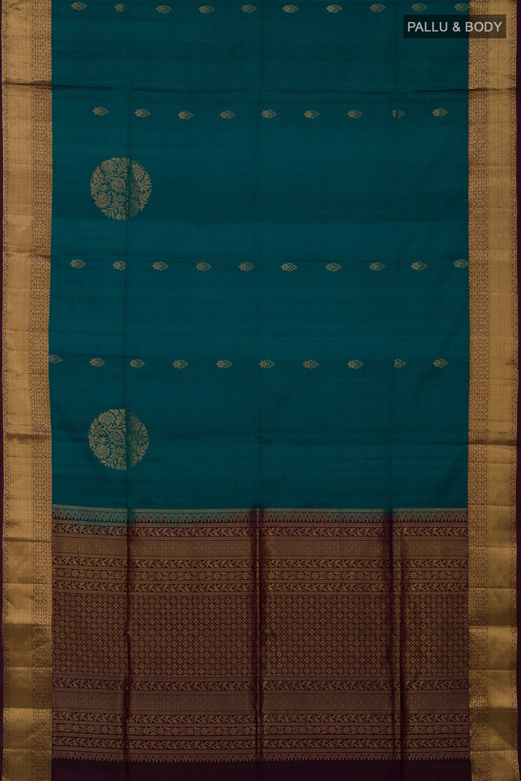 Flat view of Peacock Blue Soft Silk Saree with Zari Butta on the body and Zari Border. 