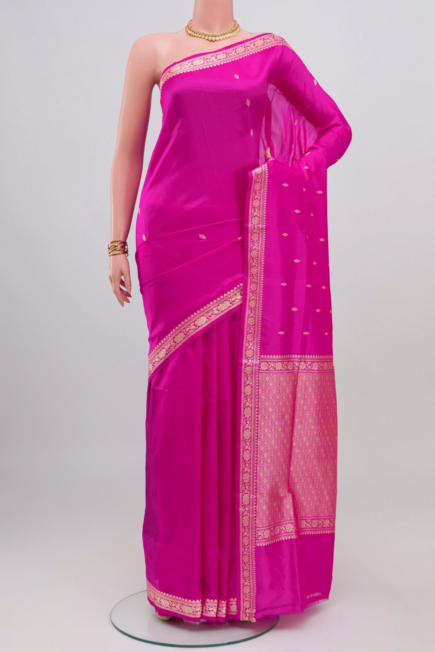 Pink Banarasi Katan Silk Saree with Thread Butta on the body and Thread Border.  displayed on a mannequin