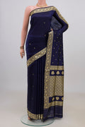 Pure Silk Navy Blue Banarasi Katan Saree with Thread Butta on the body and Thread Border.  displayed on a mannequin