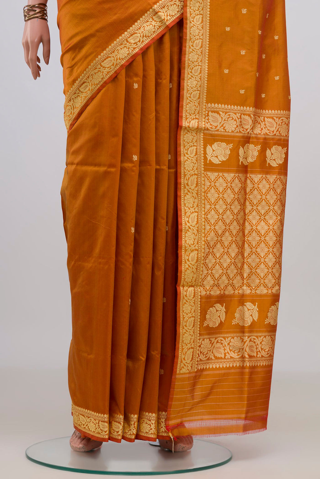 Pleats and pallu of Pure Silk Mustard Banarasi Katan Saree with Thread Butta on the body and Thread Border. 