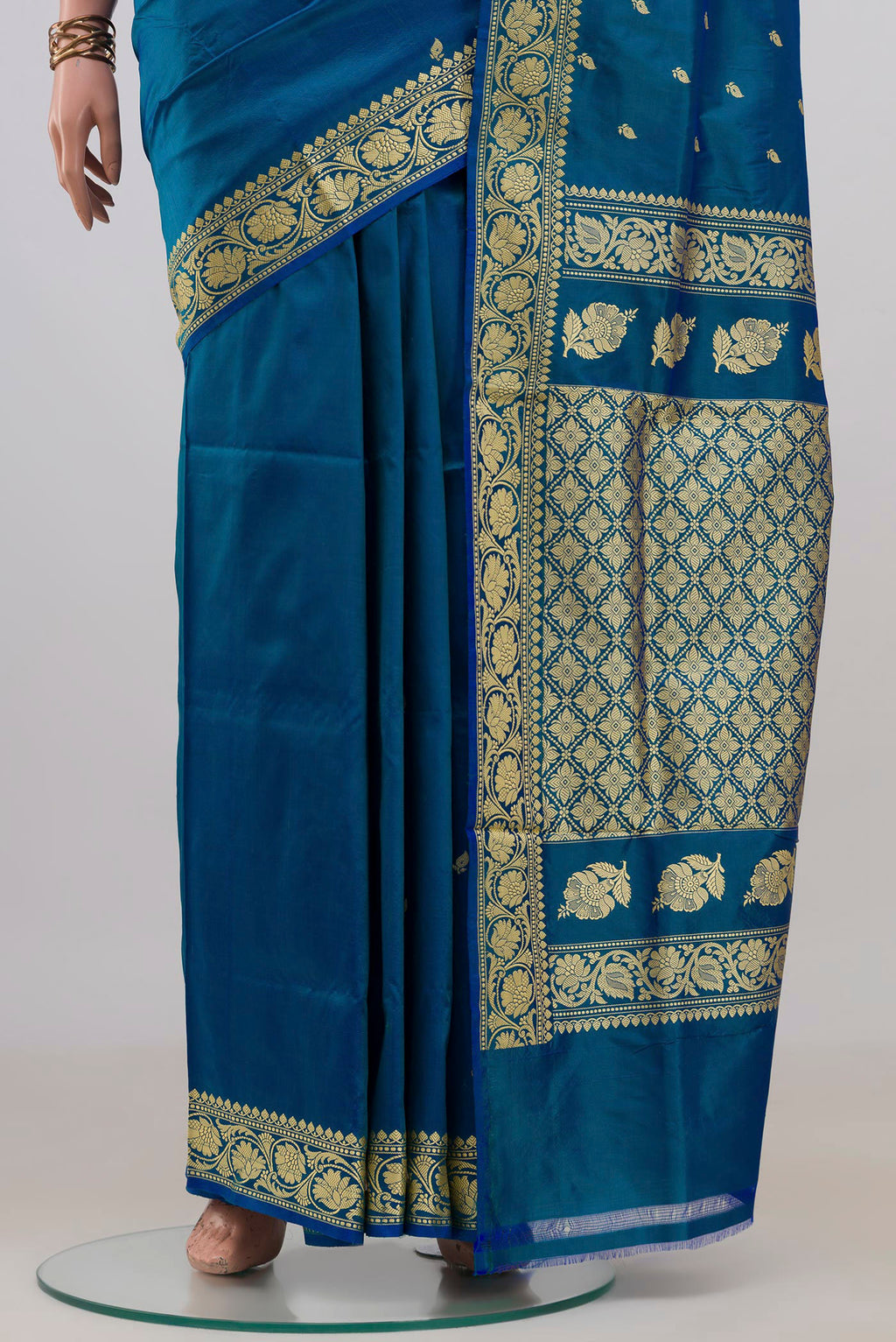 Pleats and pallu of Pure Silk Blue Banarasi Katan Saree with Thread Butta on the body and Thread Border. 