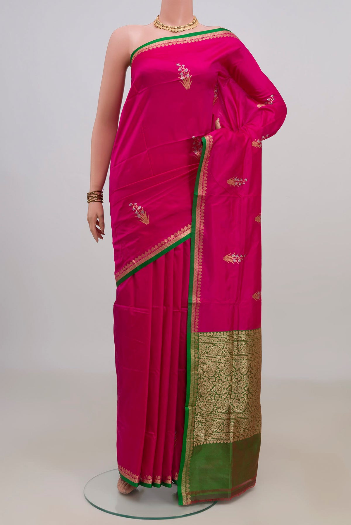 Pure Silk Pink Banarasi Katan Saree with Zari Butta on the body and Zari Border.  displayed on a mannequin