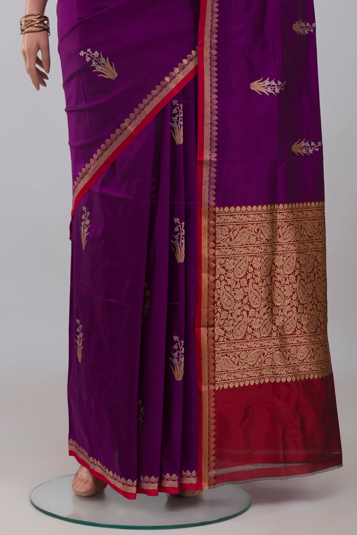 Pleats and pallu of Purple Banarasi Katan Silk Saree with Zari Butta on the body and Thin Zari Line. 
