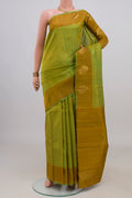 Pure Silk Green Kanchipuram Saree with Zari Butta on the body and Fancy Border.  displayed on a mannequin