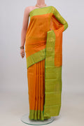 Pure Silk Yellow Kanchipuram Saree with Zari Butta on the body and Fancy Border.  displayed on a mannequin