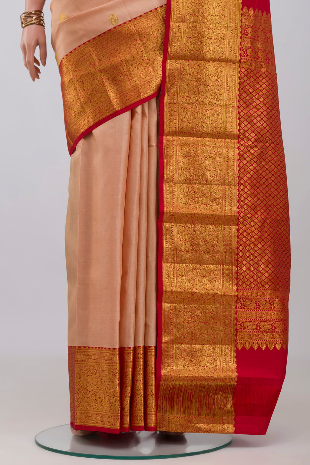 Pleats and pallu of Rose Gold Kanjivaram Silk Saree with Zari Butta on the body and Zari Border. 